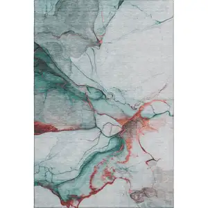 Photo of Teal Terra Cotta And Ivory Abstract Washable Area Rug With UV Protection