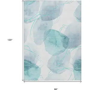 Photo of Teal and Ivory Abstract Washable Non Skid Indoor Outdoor Area Rug