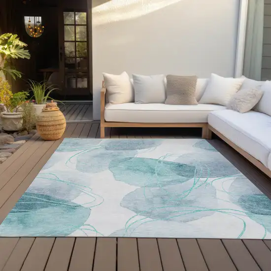 Teal and Ivory Abstract Washable Non Skid Indoor Outdoor Area Rug Photo 9
