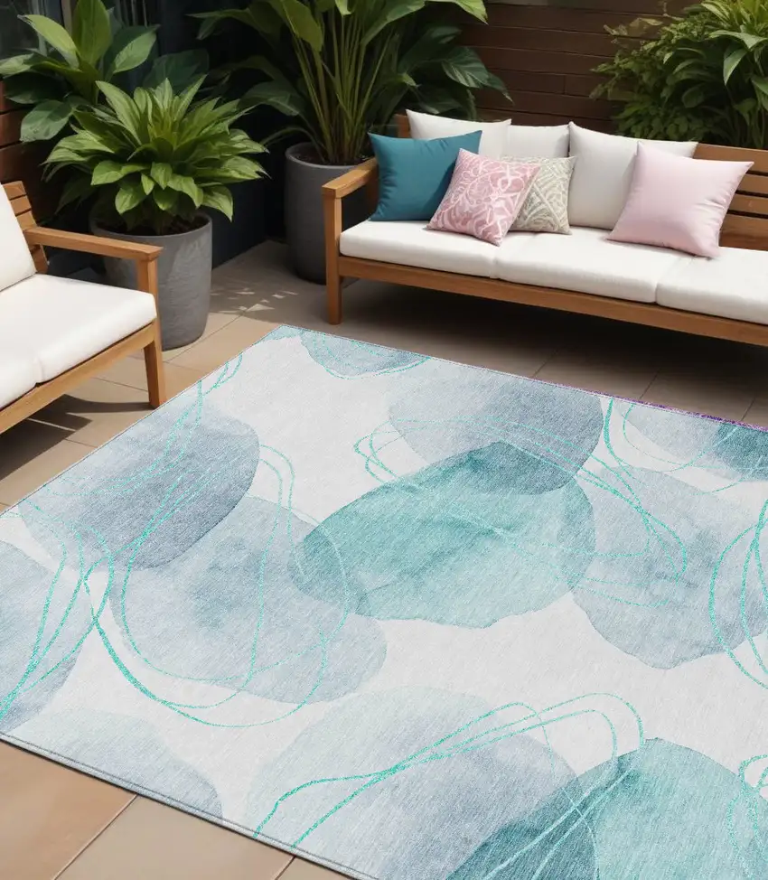 Teal and Ivory Abstract Washable Non Skid Indoor Outdoor Area Rug Photo 1