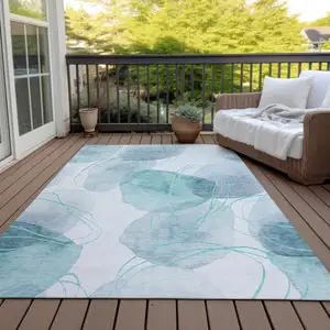Photo of Teal and Ivory Abstract Washable Non Skid Indoor Outdoor Area Rug