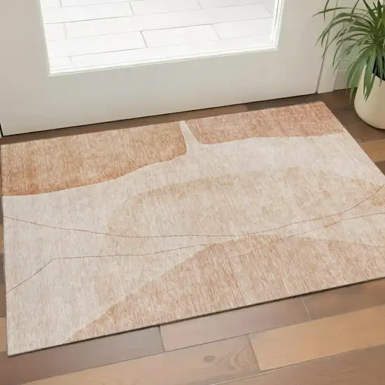 Terra Cotta And Beige Abstract Washable Area Rug With UV Protection Photo 1