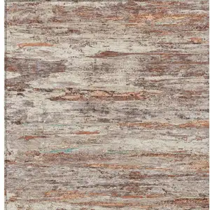 Photo of Terra Cotta And Beige Abstract Washable Indoor Outdoor Area Rug