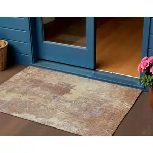 Photo of Terra Cotta And Beige Abstract Washable Indoor Outdoor Area Rug