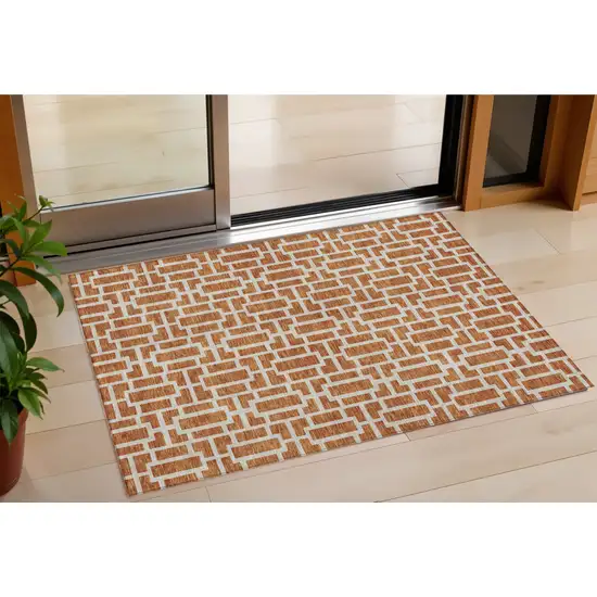 Terra Cotta And Beige Geometric Washable Indoor Outdoor Area Rug Photo 1