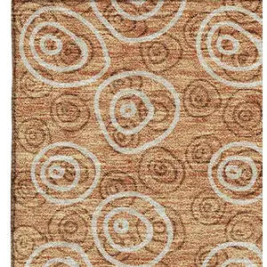 Photo of Terra Cotta And Beige Polka Dot Washable Area Rug With UV Protection