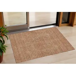 Photo of Terra Cotta And Brown Abstract Washable Indoor Outdoor Area Rug