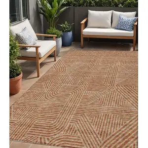 Photo of Terra Cotta And Brown Abstract Washable Indoor Outdoor Area Rug