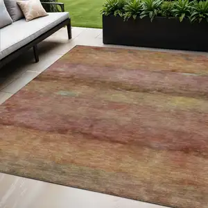 Photo of Terra Cotta And Gold Abstract Washable Indoor Outdoor Area Rug