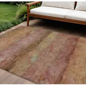 Photo of Terra Cotta And Gold Abstract Washable Indoor Outdoor Area Rug