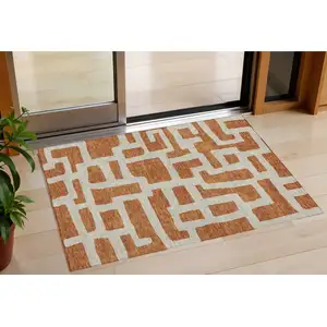 Photo of Terra Cotta And Gray Abstract Washable Indoor Outdoor Area Rug