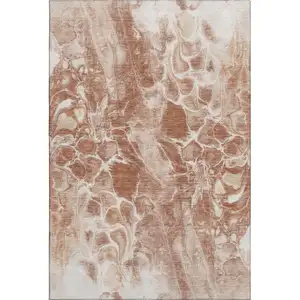 Photo of Terra Cotta And Ivory Abstract Washable Area Rug With UV Protection