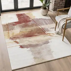 Photo of Terra Cotta And Ivory Abstract Washable Area Rug With UV Protection