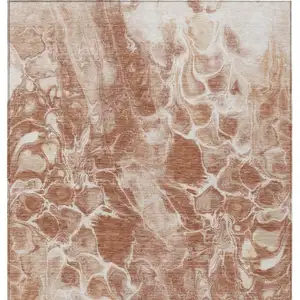 Photo of Terra Cotta And Ivory Abstract Washable Indoor Outdoor Area Rug
