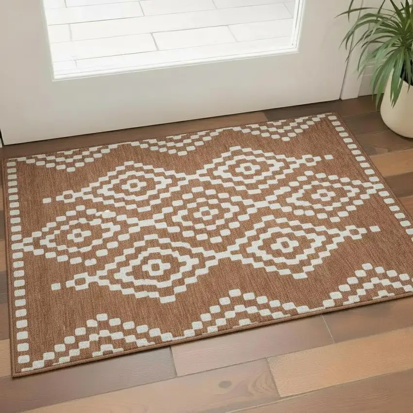 Terra Cotta And Ivory Geometric Washable Area Rug With UV Protection Photo 1