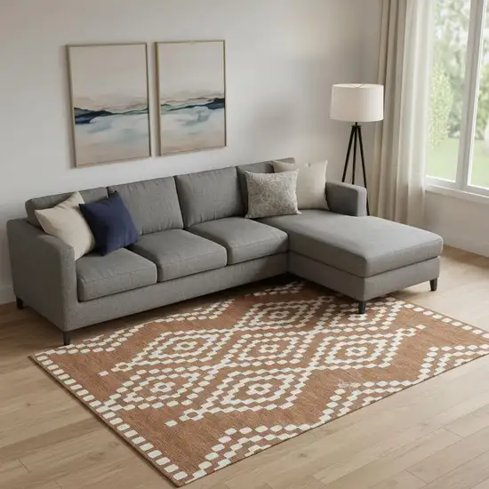 Terra Cotta And Ivory Geometric Washable Area Rug With UV Protection Photo 1