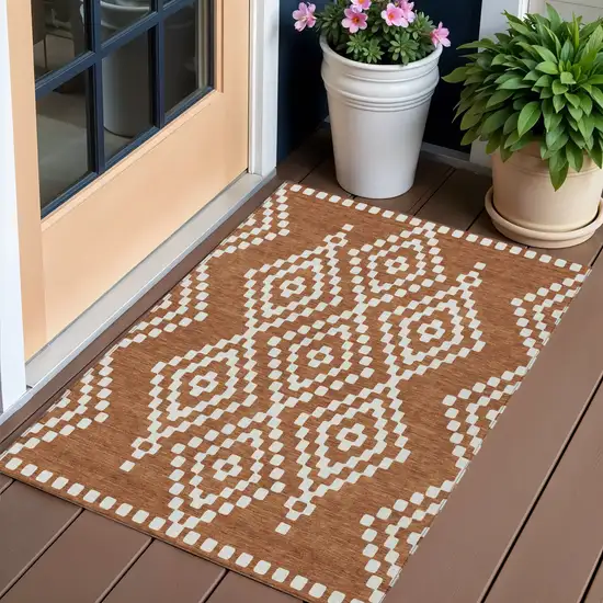 Terra Cotta And Ivory Geometric Washable Indoor Outdoor Area Rug Photo 1