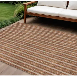 Photo of Terra Cotta And Ivory Striped Washable Indoor Outdoor Area Rug