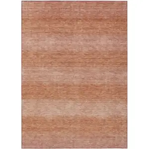 Photo of Terra Cotta And Peach Striped Washable Indoor Outdoor Area Rug