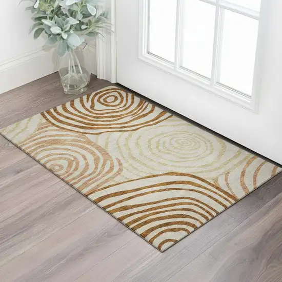 Terra Cotta Beige And Gold Abstract Washable Area Rug With UV Protection Photo 1