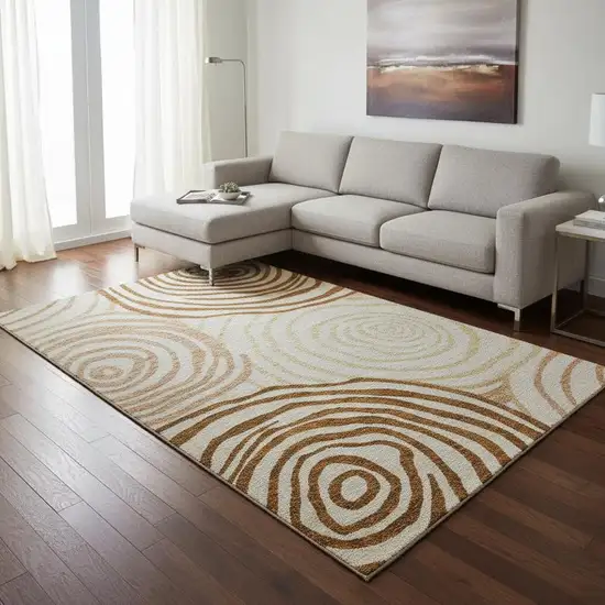 Terra Cotta Beige And Gold Abstract Washable Area Rug With UV Protection Photo 2