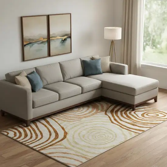 Terra Cotta Beige And Gold Abstract Washable Area Rug With UV Protection Photo 1