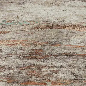 Photo of Terra Cotta Beige And Teal Abstract Washable Area Rug With UV Protection