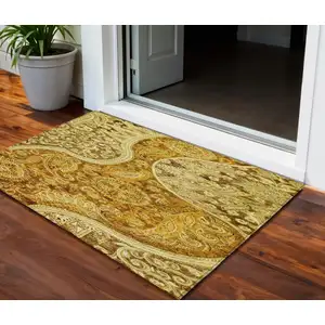 Photo of Terra Cotta Brown And Gold Floral Medallion Washable Indoor Outdoor Area Rug