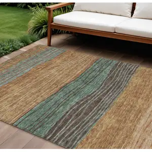 Photo of Terra Cotta Copper And Beige Striped Washable Indoor Outdoor Area Rug