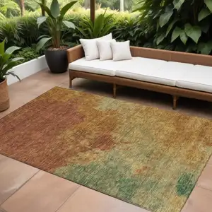 Photo of Terra Cotta Copper And Green Abstract Washable Indoor Outdoor Area Rug