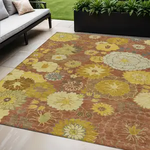 Photo of Terra Cotta Gold And Beige Floral Washable Indoor Outdoor Area Rug