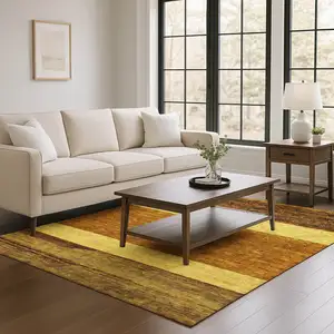 Photo of Terra Cotta Gold And Brown Striped Washable Area Rug With UV Protection