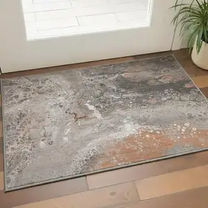 Photo of Terra Cotta Ivory And Gray Abstract Washable Area Rug With UV Protection