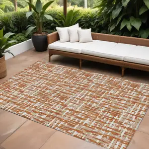 Photo of Terra Cotta Tan And Ivory Abstract Washable Indoor Outdoor Area Rug