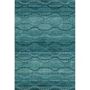 Photo of Turquoise And Aqua Abstract Geometric Washable Area Rug With UV Protection