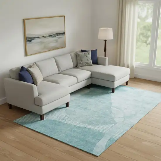 Turquoise And Ivory Abstract Geometric Washable Area Rug With UV Protection Photo 1