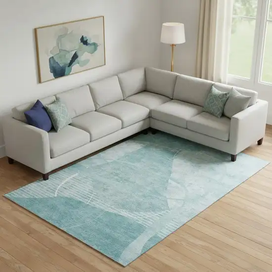 Turquoise And Ivory Abstract Geometric Washable Area Rug With UV Protection Photo 1