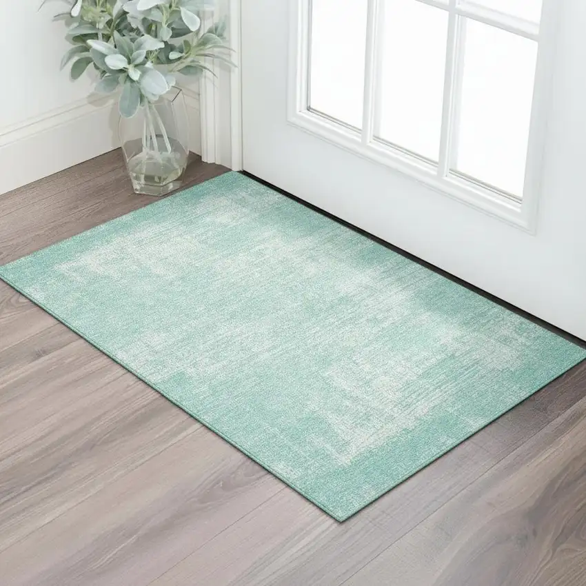 Turquoise And Ivory Abstract Washable Area Rug With UV Protection Photo 1