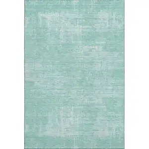 Photo of Turquoise And Ivory Abstract Washable Area Rug With UV Protection