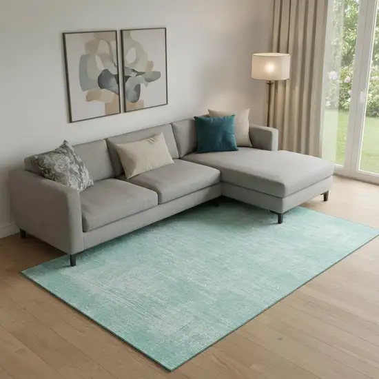 Turquoise And Ivory Abstract Washable Area Rug With UV Protection Photo 1