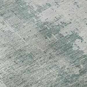 Photo of Turquoise And Ivory Abstract Washable Area Rug With UV Protection