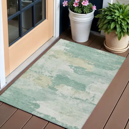 Turquoise And Ivory Abstract Washable Indoor Outdoor Area Rug Photo 1