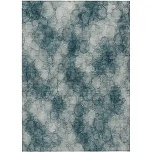 Photo of Turquoise And Ivory Abstract Washable Indoor Outdoor Area Rug