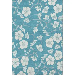 Photo of Turquoise And Ivory Floral Washable Area Rug With UV Protection