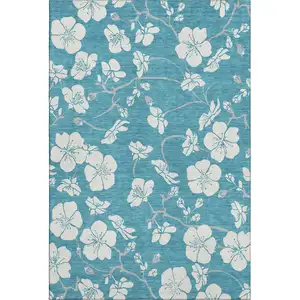 Photo of Turquoise And Ivory Floral Washable Area Rug With UV Protection