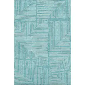 Photo of Turquoise And Ivory Geometric Washable Area Rug With UV Protection