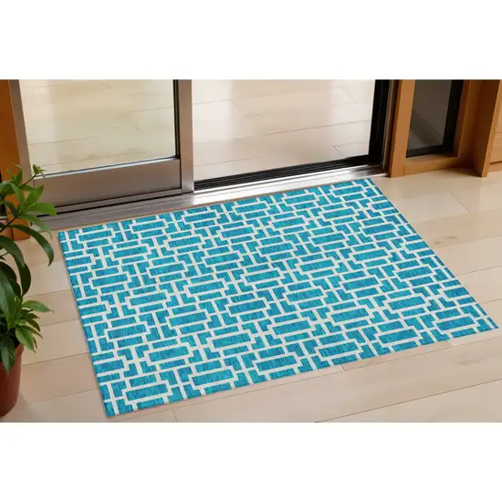 Turquoise And Ivory Geometric Washable Indoor Outdoor Area Rug Photo 1