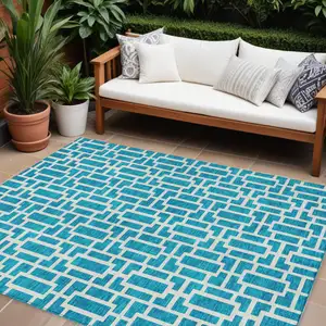 Photo of Turquoise And Ivory Geometric Washable Indoor Outdoor Area Rug