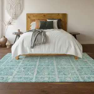 Photo of Turquoise And Ivory Medallion Washable Area Rug With UV Protection
