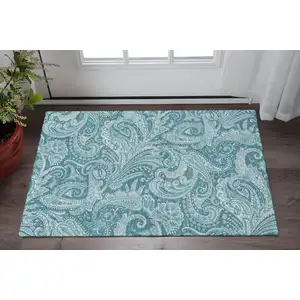 Photo of Turquoise And Ivory Paisley Washable Area Rug With UV Protection